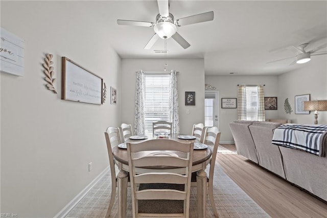 dining space with plenty of natural light, baseboards, and ceiling fan