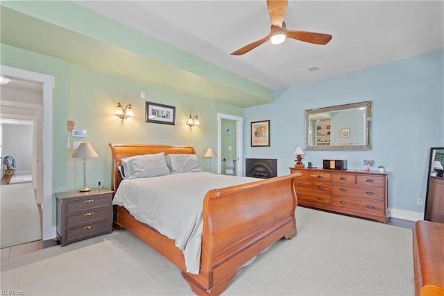 bedroom featuring a ceiling fan and baseboards