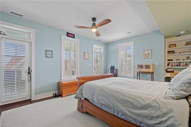 bedroom with baseboards, ceiling fan, visible vents, and access to exterior