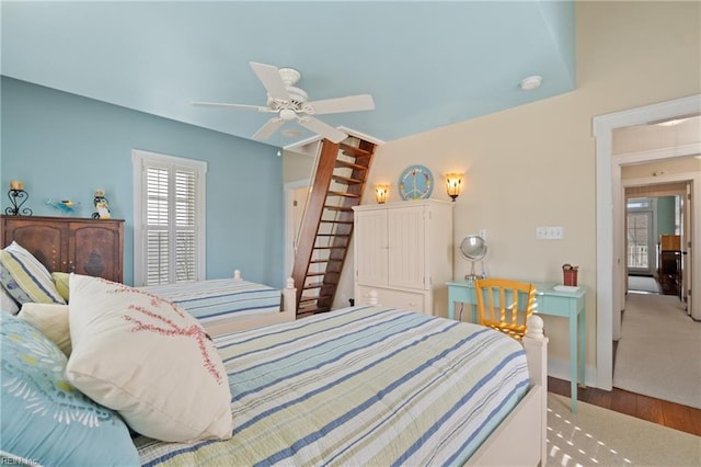 bedroom with ceiling fan and wood finished floors