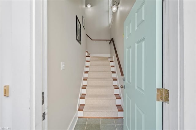 stairs with tile patterned flooring and baseboards