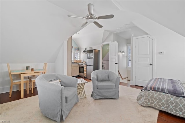 sitting room with lofted ceiling, ceiling fan, and wood finished floors