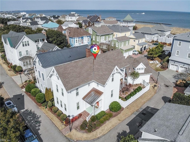 birds eye view of property featuring a residential view and a water view