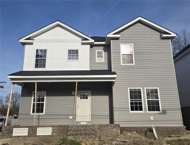 view of front facade featuring covered porch and board and batten siding