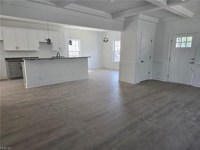 2514 Oak Ave, Newport News, VA 23607 - kitchen featuring beam ceiling, plenty of natural light, coffered ceiling, open floor plan, and a kitchen island with sink