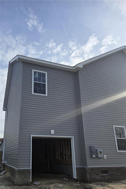 view of side of property featuring a garage