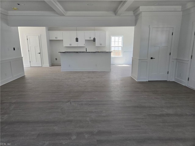 2514 Oak Ave, Newport News, VA 23607 - kitchen with beam ceiling, white cabinets, dark wood-style flooring, dark countertops, and a decorative wall