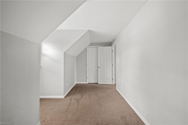 bonus room with vaulted ceiling, baseboards, and carpet floors