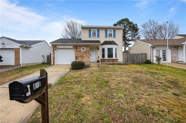 traditional-style house with an attached garage, brick siding, fence, concrete driveway, and a front lawn