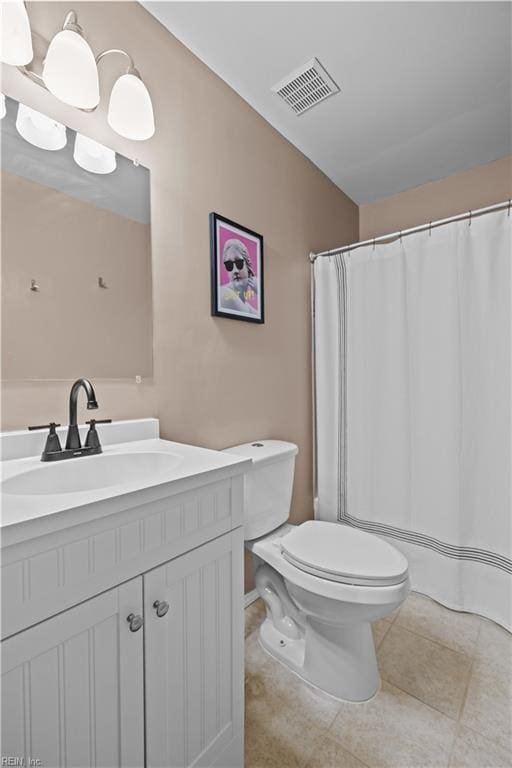 full bath with visible vents, a shower with shower curtain, toilet, vanity, and tile patterned flooring