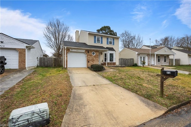 traditional-style house with brick siding, concrete driveway, an attached garage, fence, and a front yard