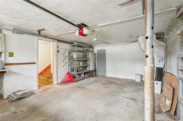 parking garage with water heater and a garage door opener