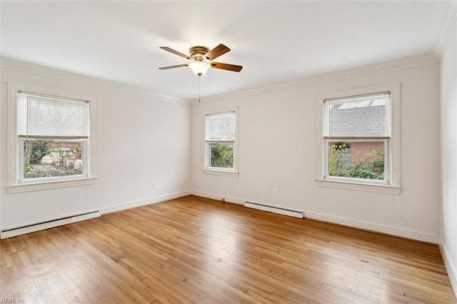 empty room with light wood-type flooring, ornamental molding, a baseboard radiator, and baseboards