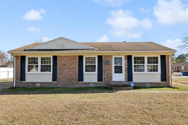 view of front of house with brick siding, crawl space, a front yard, and a shingled roof