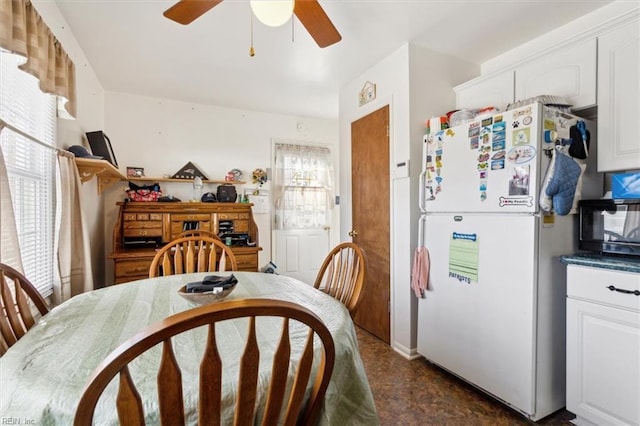 dining space featuring a ceiling fan