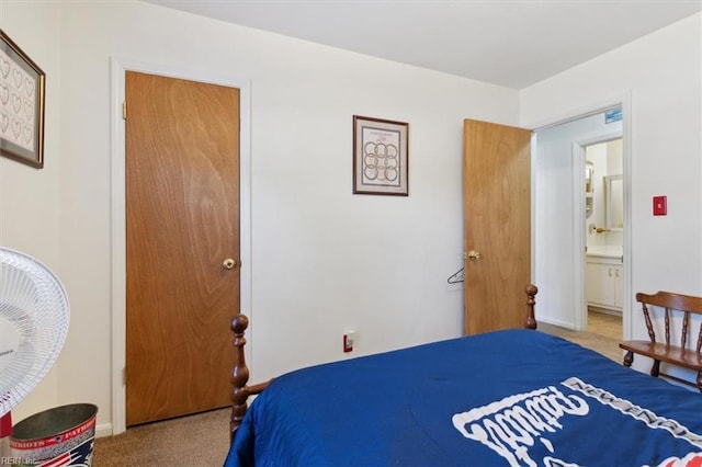 carpeted bedroom featuring baseboards