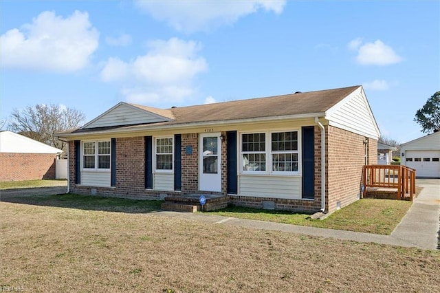 ranch-style house with crawl space, brick siding, a front lawn, and an outbuilding