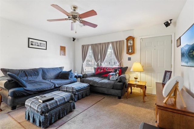 living area with carpet floors and a ceiling fan