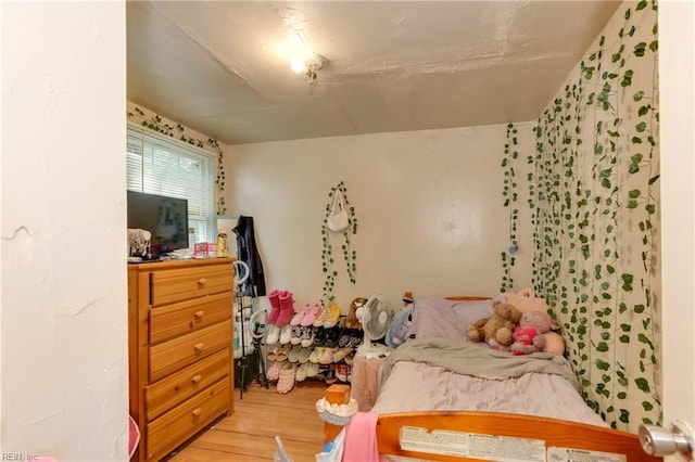 bedroom with light wood-type flooring