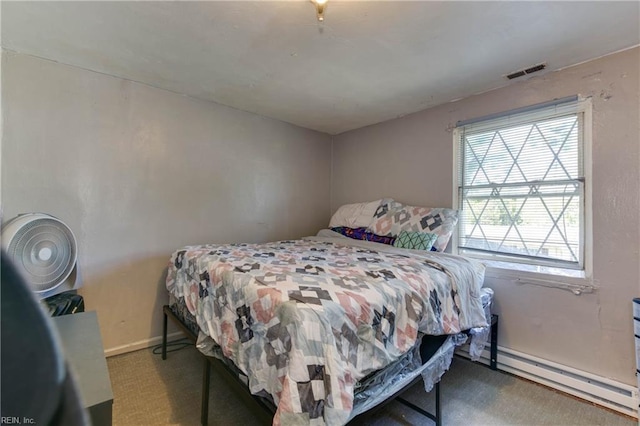 carpeted bedroom featuring baseboards, visible vents, and baseboard heating