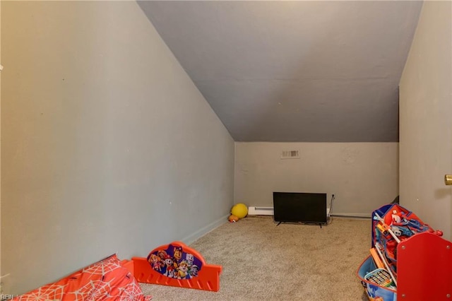 playroom featuring carpet floors, lofted ceiling, and a baseboard radiator