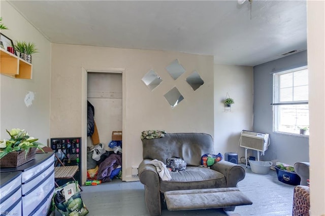 living area with wood finished floors and visible vents