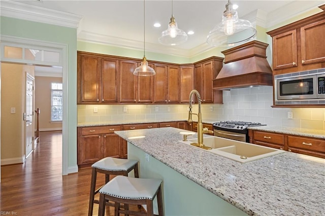 kitchen featuring crown molding, appliances with stainless steel finishes, backsplash, dark wood finished floors, and custom range hood