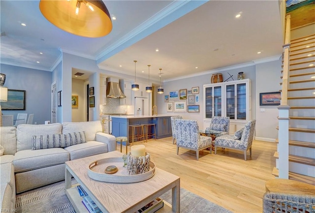 living room featuring light wood-style flooring, ornamental molding, recessed lighting, stairway, and baseboards