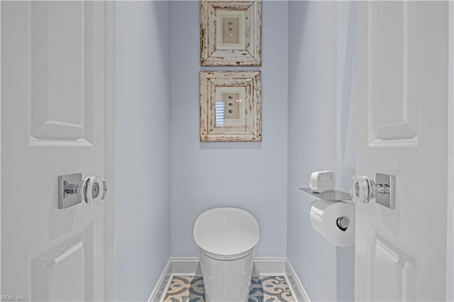 bathroom with baseboards