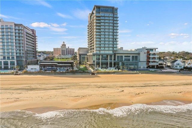 exterior space with a view of city, a water view, and a view of the beach