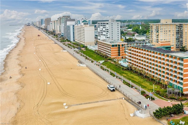 aerial view featuring a view of the beach, a view of city, and a water view