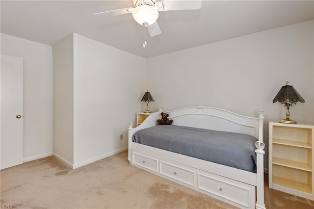 carpeted bedroom featuring ceiling fan and baseboards