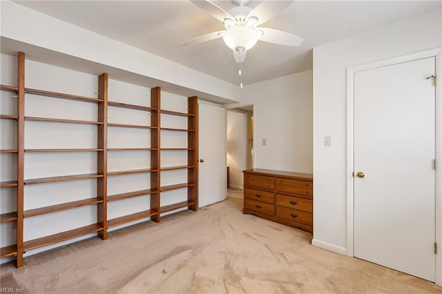 unfurnished bedroom featuring a ceiling fan and light carpet