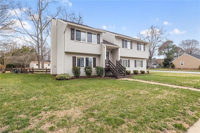 bi-level home featuring a chimney and a front lawn