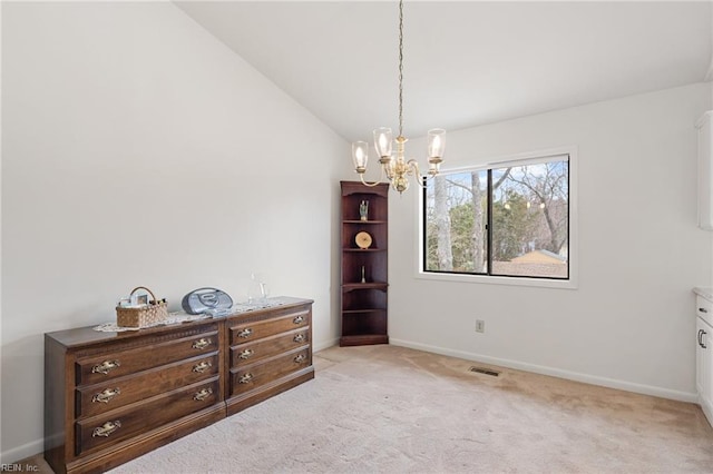 interior space featuring a chandelier, light colored carpet, visible vents, baseboards, and vaulted ceiling