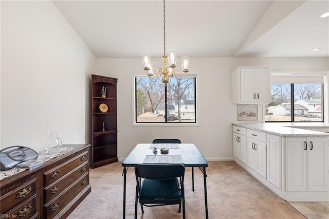 office with light carpet, baseboards, a chandelier, and lofted ceiling