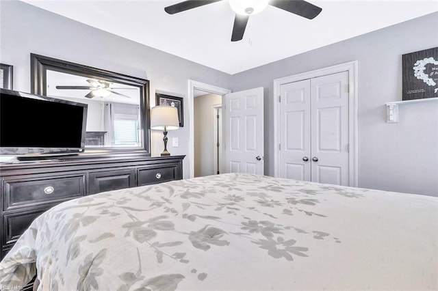 bedroom with a ceiling fan and a closet