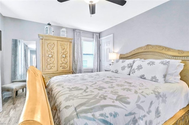 bedroom featuring light wood-style flooring and a ceiling fan