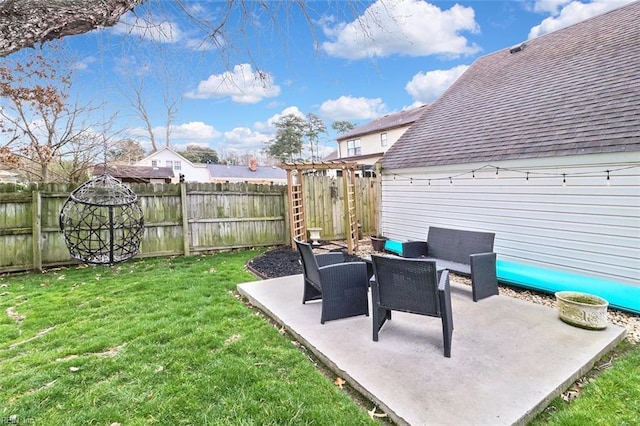 view of yard featuring a patio area and a fenced backyard