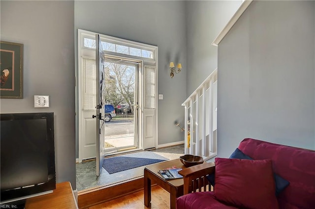 entryway with stairs and baseboards