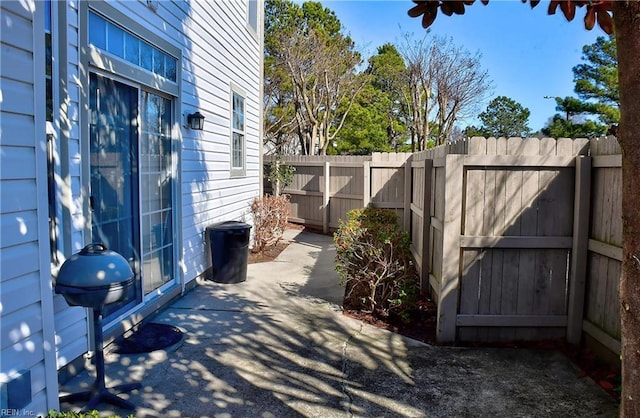 view of patio / terrace with grilling area and fence