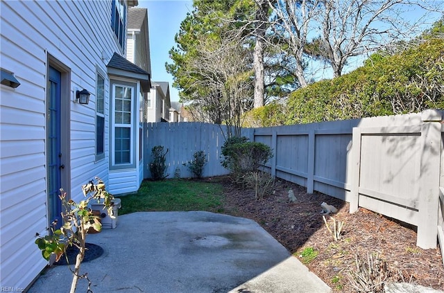 view of yard featuring a fenced backyard and a patio