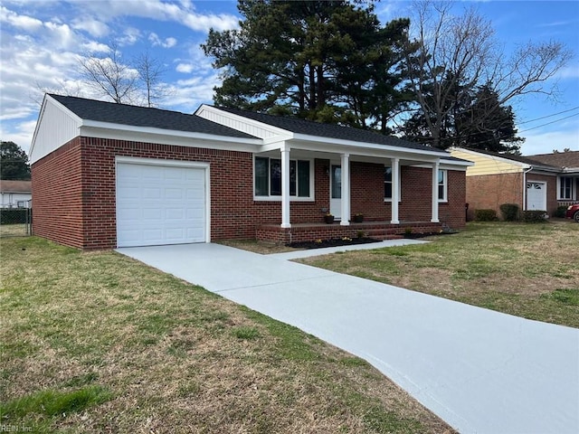 single story home featuring a front yard, a garage, covered porch, and brick siding