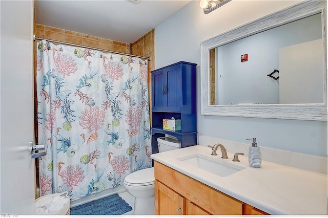 full bath with a shower with shower curtain, vanity, and toilet