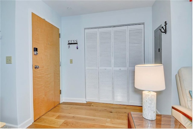 interior space with light wood-type flooring and baseboards