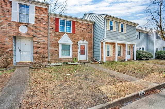 multi unit property featuring brick siding