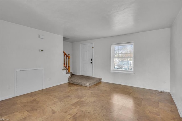 entryway with stairs and baseboards