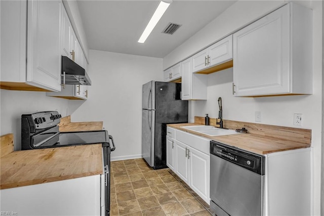 kitchen featuring stainless steel appliances, a sink, white cabinets, wooden counters, and range hood