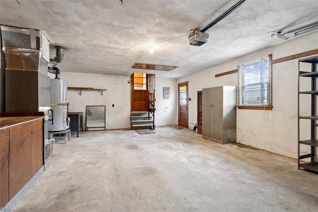 garage featuring electric panel, a garage door opener, and water heater