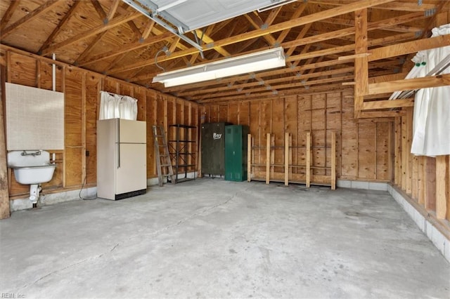 garage with freestanding refrigerator